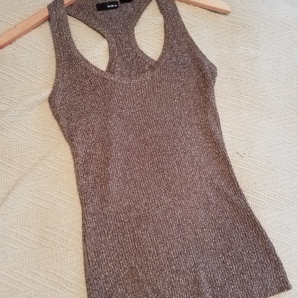 Adorable racerback tank with metallic threading.